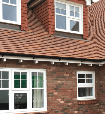 Wealden Homes - Britannia Cast Iron Half Round Gutters and Cast Collared Downpipes