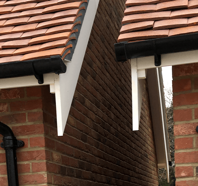 Wealden Homes - Britannia Cast Iron Half Round Gutters and Cast Collared Downpipes