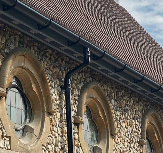 Cast iron guttering alternative ARP black aluminium downpipes and Sentinel gutters Graylingwell Chapel
